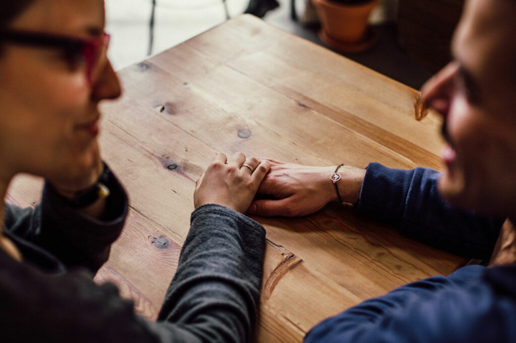 two people talking at a table